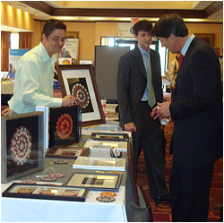 March 2008 - James Malcolm (left) discussing his artwork with North Carolina State Treasurer Richard Moore at the 2008 NC Indian Unity Conference in Raleigh, NC.